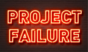 Project failure neon sign on brick wall background