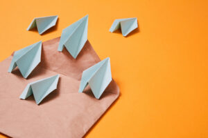 Paper planes on brown envelope